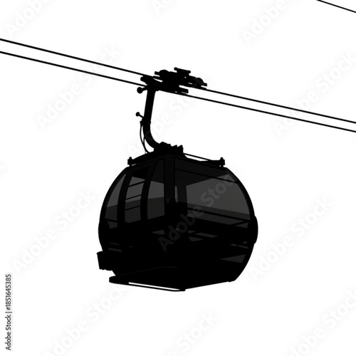 Silhouette of a cable car or gondola lift cabin suspended from cables with urban landscape