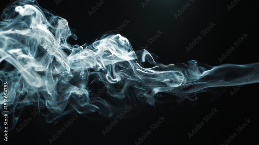 Fototapeta premium Smoke forms patterns in the dark space as it moves and swirls in a dynamic display of fluid motion