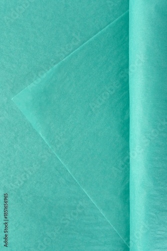 Soft turquoise tissue wrapping material for flowers stacked in sheets isolated on white background used for bouquet presentation decor and packaging