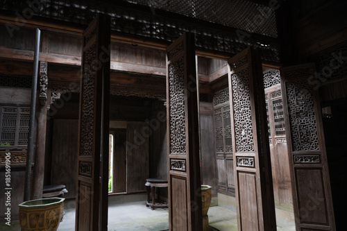 Gorgeous traditional Chinese building of Hui-style architecture, beautiful sunlight shines on the door, in Anhui Province, China.