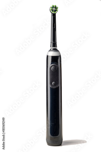 Black electric toothbrush isolated on a white background
