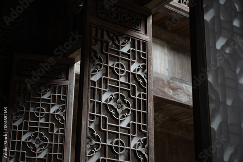 Gorgeous traditional Chinese building of Hui-style architecture, beautiful sunlight shines on the door, in Anhui Province, China.