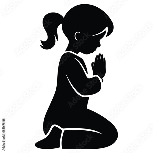 Silhouette of a girl kneeling and praying