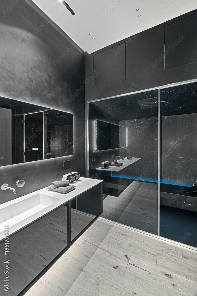 custom made wallpaper toronto digitalModern black bathroom interior with parquet flooring, sink cabinet in the left foreground and glass shower enclosure in the background, minimalist contemporary design