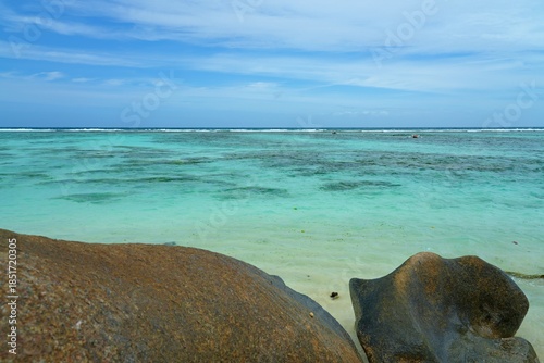 Day view of the Anse Source d Argent beach with its granite boulders on La Digue island in the Seychelles, one of the most beautiful beaches in the world