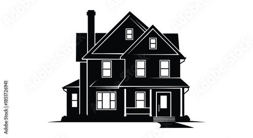 A striking black house with a tall chimney and detailed windows a dark silhouette