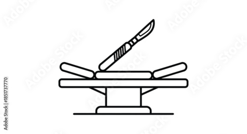 Surgical scalpel resting on a sterile examination table, symbolizing medical care and procedures.