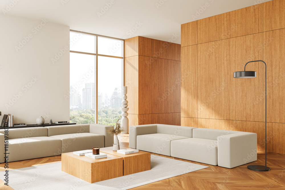Fototapeta premium Modern interior design of spacious living room featuring neutral sofas, wooden wall panels, and large windows with cityscape view in daylight. 3D Rendering