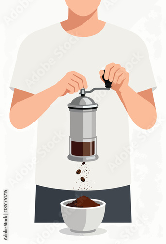 Person grinding coffee beans by hand, fresh grounds falling into a bowl