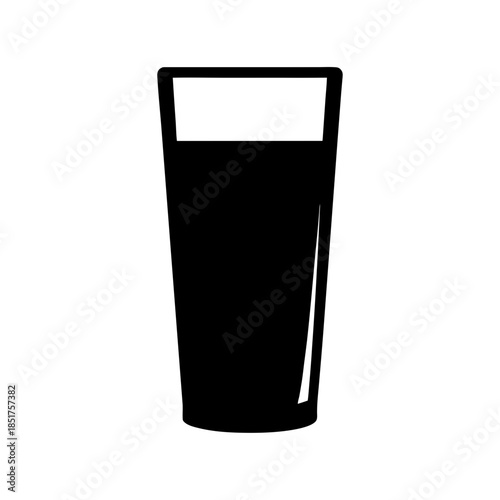 A tall glass of dark beverage