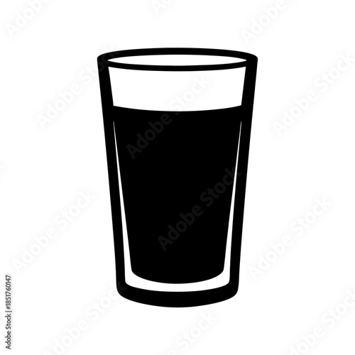 A glass of dark beverage