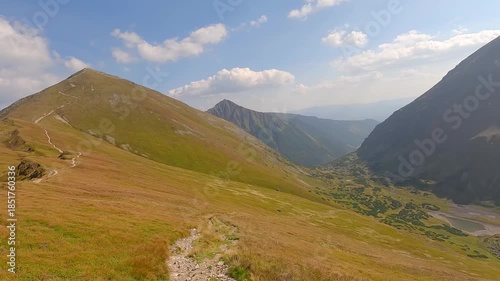 Hiking from Rackovo sedlo to Rackova dolina valley with view to Rackove plesa lakes and Klin and Nizna Bystra hills in Western Tatras mountains in Slovakia
