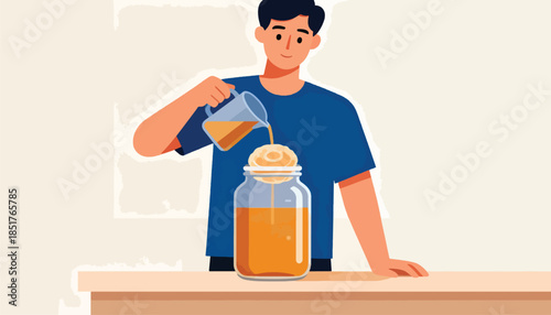 Man pouring orange liquid into a jar with a SCOBY