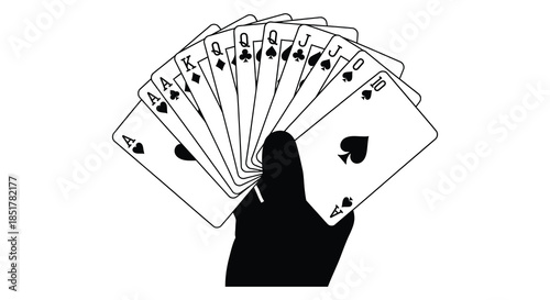 A hand holding a fan of playing cards in a striking black silhouette