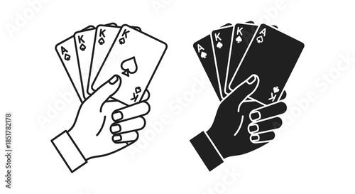 A hand holding playing cards showcasing a classic and dramatic silhouette