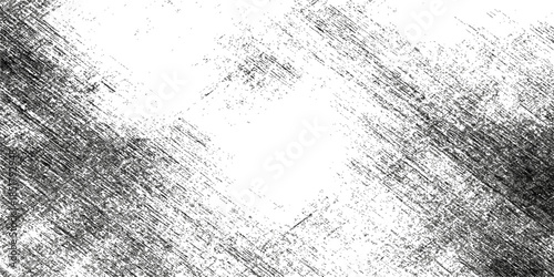 A vintage black and white abstract grunge background features a dirty textured metal surface with a rough gray concrete pattern and old paint on a weathered stone wall backdrop