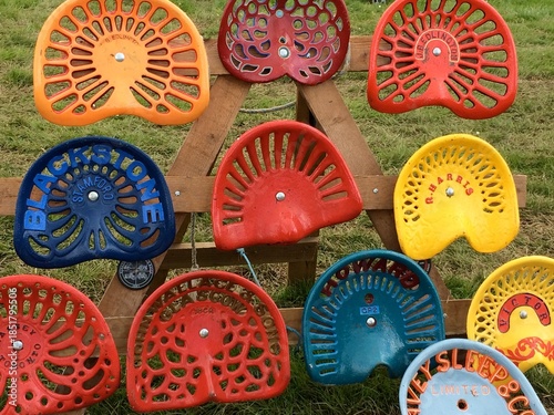 Display of vintage tractor seats 