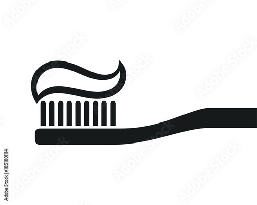 A toothbrush with toothpaste on it stands ready for use on a white background.