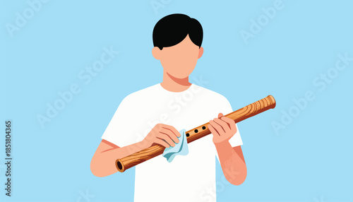 Person cleans wooden flute with cloth