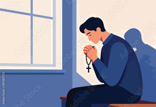 Man praying with rosary beads in front of window