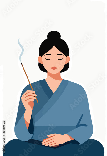 A woman in a blue robe meditates with closed eyes, holding a smoking incense stick