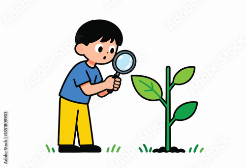 Curious child examines tiny plant with magnifying glass on grass