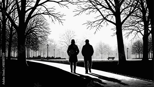 Two people walking on a path in a park.