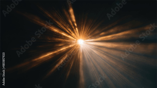 Golden light rays shining brightly in dark space