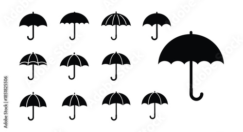 A collection of black silhouette umbrellas in various shapes and sizes