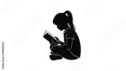 Young girl reading a book quietly
