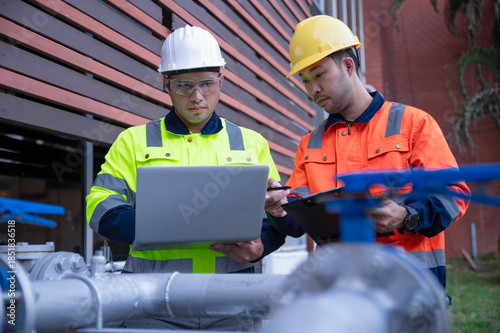 Quadro su tela A specialist engineer and an inspector are discussing installing an additional high-pressure water pump to ensure sufficient water supply