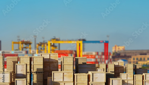 Fotografi Port logistics stacks wooden cargo crates at a container terminal