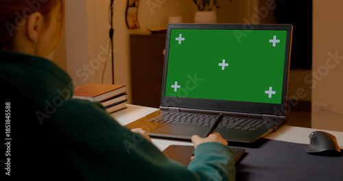 Photography Graphic designer creating digital art on pen tablet, working with laptop and gre