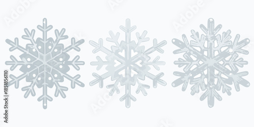 Three delicate light blue snowflakes displayed in a simple horizontal arrangement