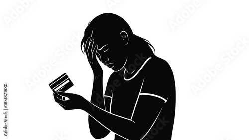 Stressed woman looking at a credit card contemplating debt or financial problems in black and white