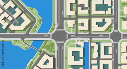 Aerial view of a modern city intersection with buildings and a river.