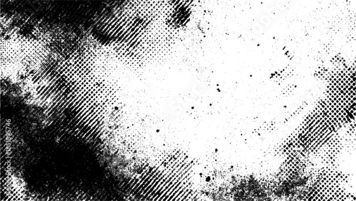 Abstract black and white grunge texture with halftone dot pattern and weathered surface.	