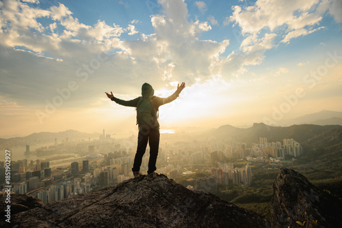 Photography Successful woman hiker on the mountain top cliff edge in Hong Kong