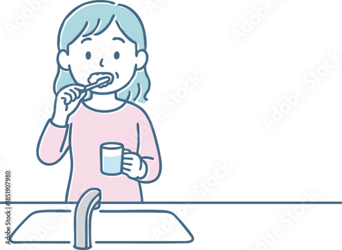 歯磨きをする女性
A woman brushing her teeth