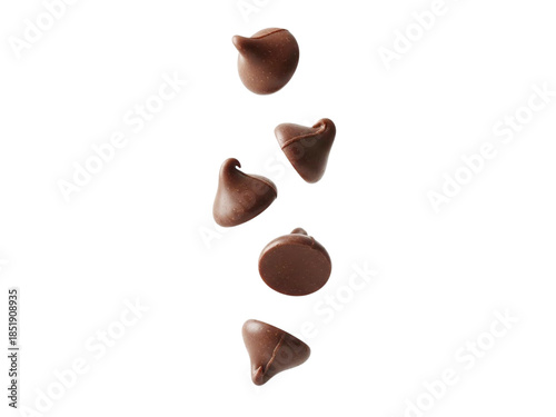 Chocolate chips falling in air with smooth surface