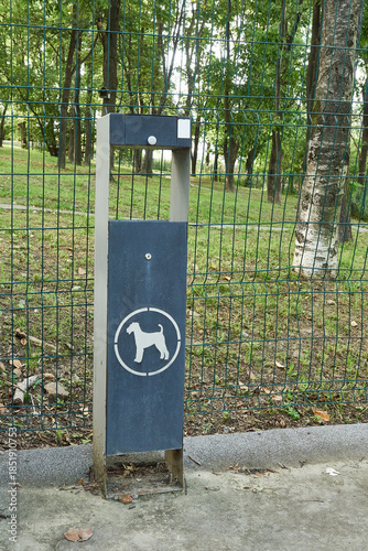 Dog excrement bin in the park. Dog walking