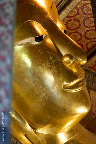 Bangkok, Thailand - 21st December 2025: Close up of face of Reclining Buddah Temple of the Reclining Buddha