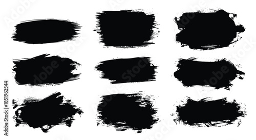 Versatile collection of nine hand-painted abstract black brush strokes and paint splatters showcasing various textures and shapes on a white background.