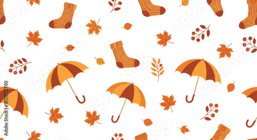 Delightful autumn seamless pattern showcases cozy umbrellas warm socks and a charming mix of fall leaves and berries on a white background.