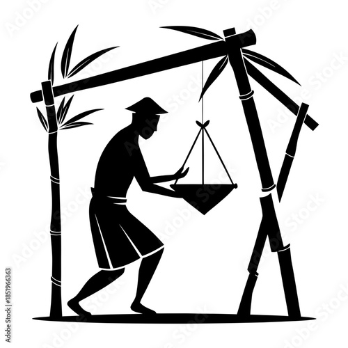 Worker using a balance scale in a bamboo structure during daylight hours