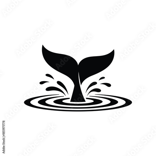 A striking black silhouette of a whale tail breaching the water surface