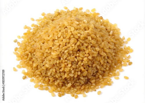A pile of golden bulgur wheat grains on a white background isolated on white background