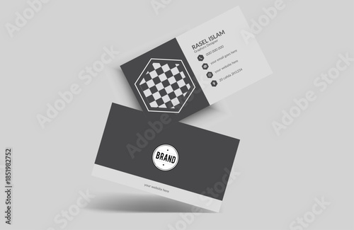 Two business cards with dark grey and white design, one with checkerboard pattern and contact info information