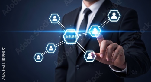 Businessman interacting with glowing digital insure network icons on a dark background