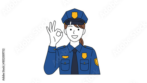 Friendly female police officer in a blue uniform and cap smiling and showing the OK hand sign as a gesture of approval.